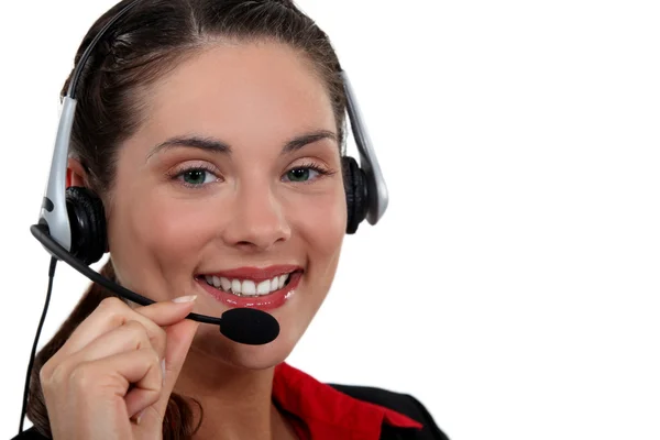 Eine Geschäftsfrau mit Kopfhörer. Stockbild