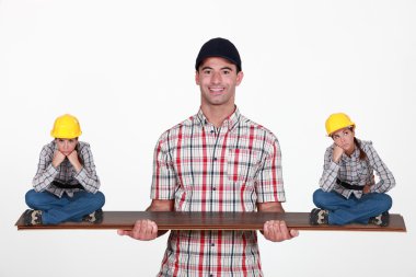 Construction manager balancing disgruntled staff clipart