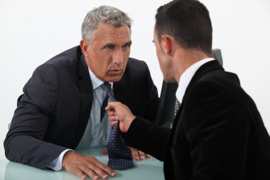 Two businessmen arguing clipart