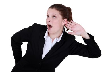 Businesswoman exaggerating listening clipart