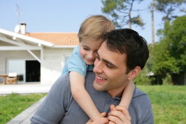 Father and son in the garden clipart