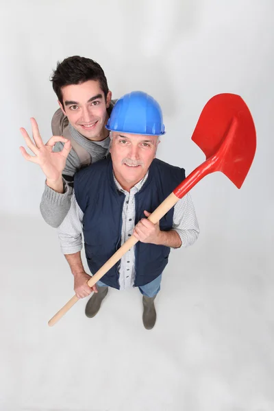 Builder stood with young apprentice — Stock Photo, Image