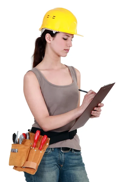 Constructora sosteniendo portapapeles —  Fotos de Stock