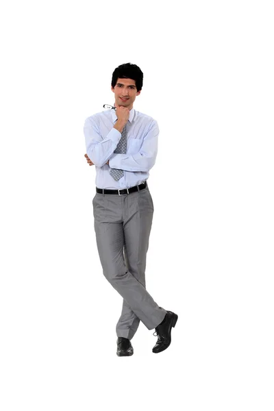 Young businessman standing with head resting on fist — Stock Photo, Image