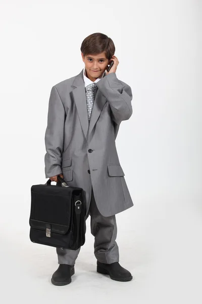 Mały chłopiec przebrany za biznesmena — Zdjęcie stockowe