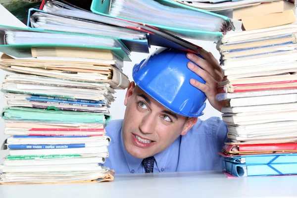 An architect worry about his folders construction. — Stock Photo, Image