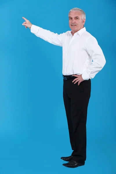 Man pointing to an invisible object — Stock Photo, Image