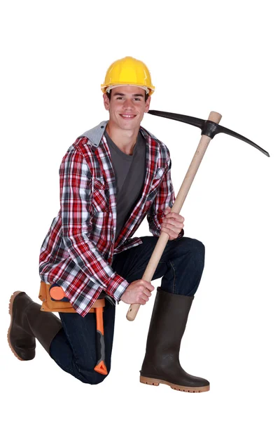 Young man with pick-axe — Stock Photo, Image
