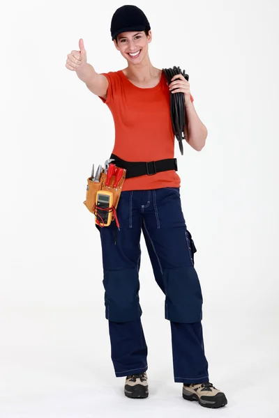 Female electrician giving thumbs-up — Stock Photo, Image