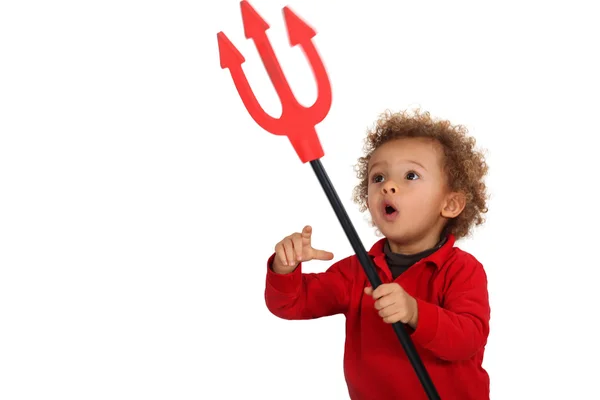 Young child holding up a devil's fork — Stock Photo, Image
