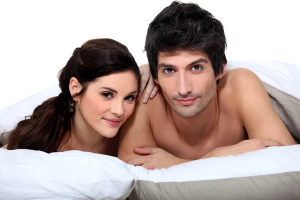 Couple in bed Royalty Free Stock Photos