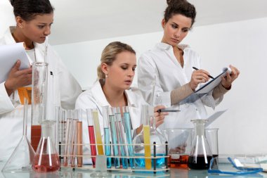 Women working in a scientific laboratory clipart