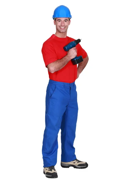 Fullbody portrait of craftsman holding cordless drill — Stock Photo, Image