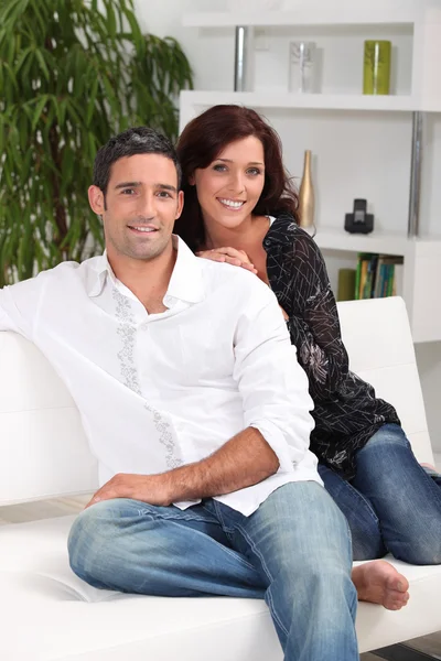 Portrait of a couple on a couch — Stock Photo, Image