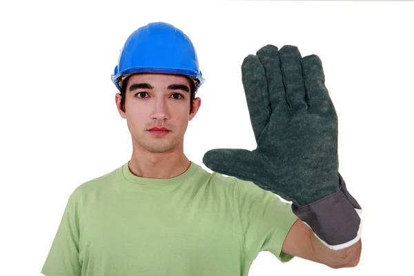 stock image Young tradesman wearing an oversized glove
