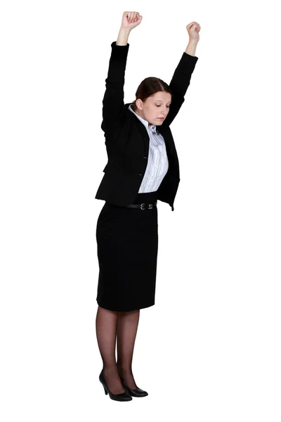 Businesswoman stretching at work — Stock Photo, Image