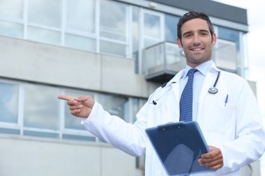 Doctor pointing outside clipart