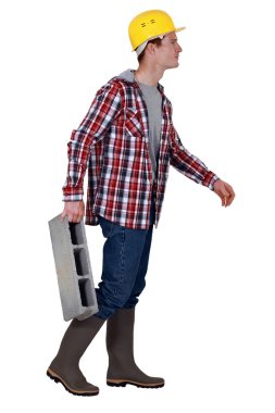 Mason carrying breeze block clipart