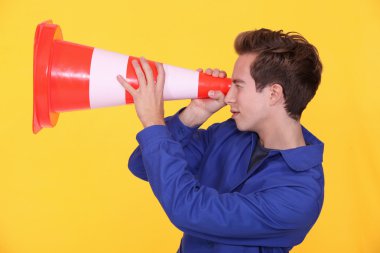 Worker with a traffic cone clipart