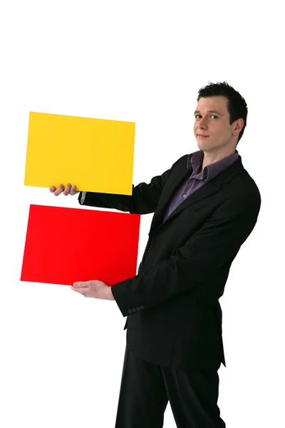 Podnikatel drží žluté a červené obdélníky — Stock fotografie