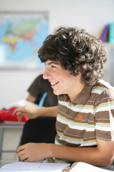 Teens in classroom Stock Picture