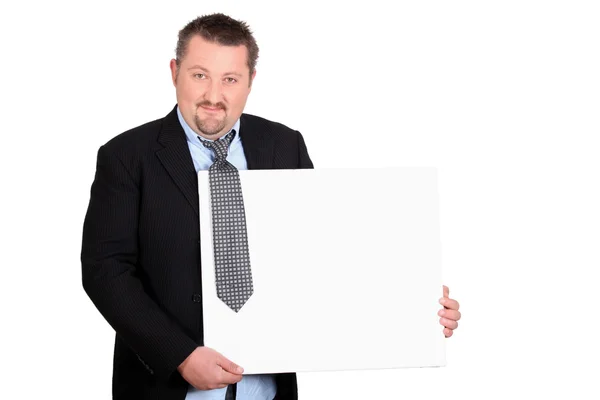 Vrolijke maar smerig zakenman met een bord leeg voor uw afbeelding Rechtenvrije Stockfoto's
