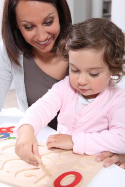 Mother and daughter doing a wooden clipart