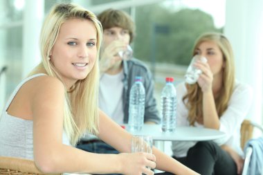 Friends having a drink of water clipart