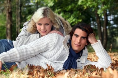 Portrait of a couple on leaves clipart