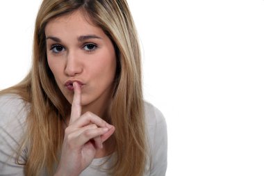 Blond woman making shush gesture clipart