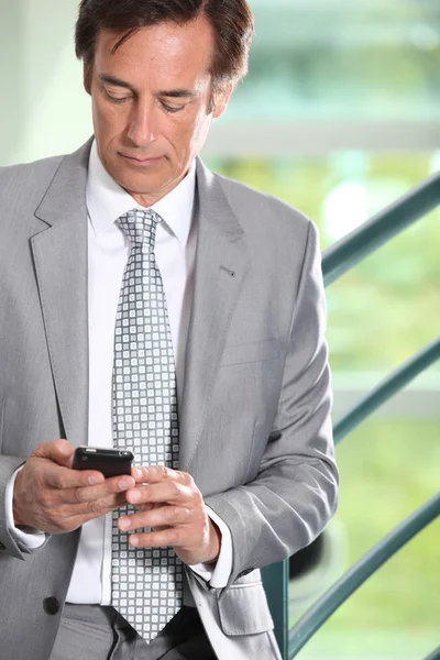 Businessman texting — Stock Photo, Image