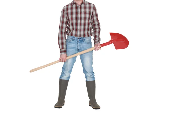 Обрезанная фотография строителя, держащего лопату . — стоковое фото