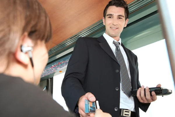 stock image Tram conductor checking ticket