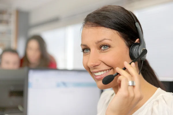Smiling employee with headset — Stock Photo, Image