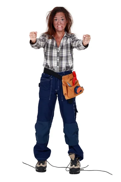 Female electrician in a state of shock after an accident — Stock Photo, Image