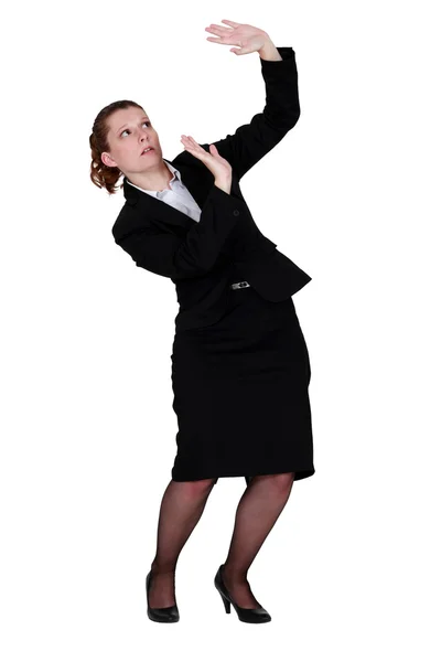 Woman protecting herself with raised hands — Stock Photo, Image