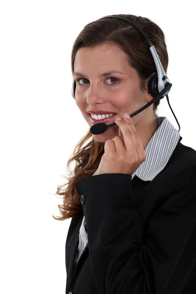 Smiling woman with a headset — Stock Photo, Image