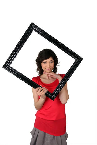 Woman with black frame in hand — Stock Photo, Image