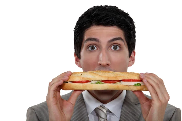 A man holding a sandwich. — Stock Photo, Image