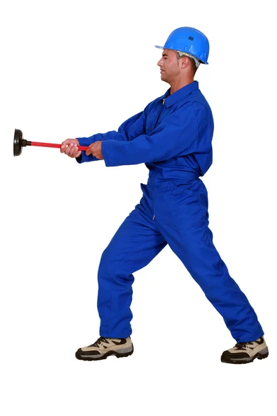 Worker with a plunger — Stock Photo, Image