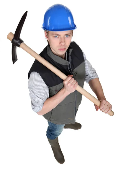 Tradesman holding a pickaxe — Stock Photo, Image