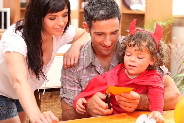 Little boy and parents preparing Halloween party — Stock Photo, Image