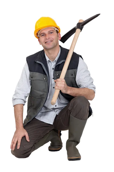 Construction worker with a pickaxe — Stock Photo, Image