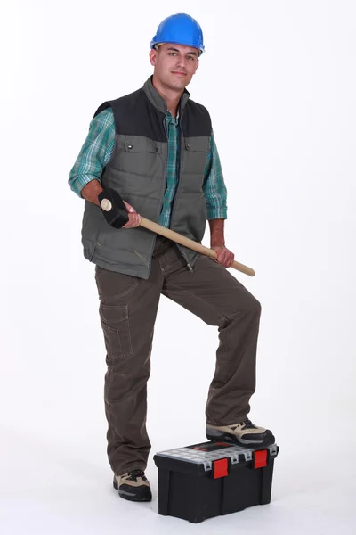 Portrait of a tradesman holding a mallet — Stock Photo, Image