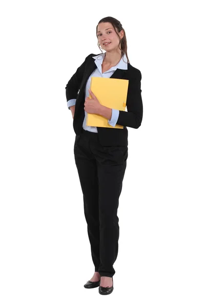 Friendly looking businesswoman holding folder — Stock Photo, Image