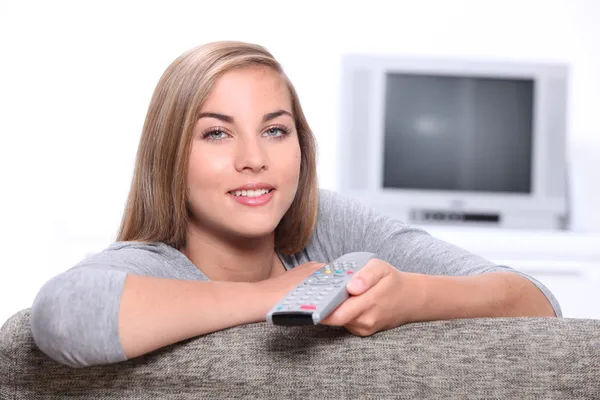 Teenager with remote control — Stock Photo, Image