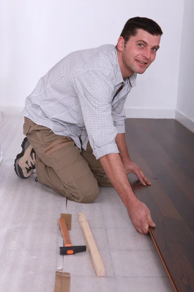 Man renovating the floor — Stock Photo, Image