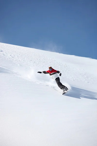 Man snowboarding down hill — Stock Photo, Image