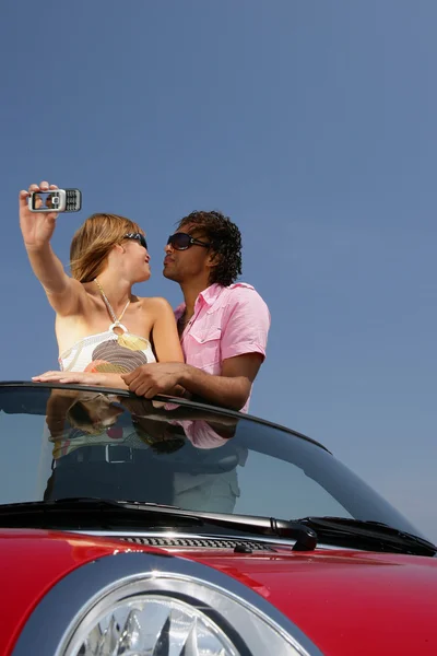 Couple taking their own photo — Stock Photo, Image