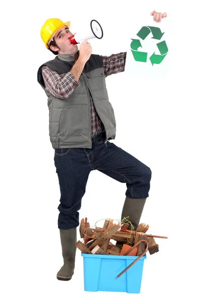 Portrait of carpenter with loudspeaker and recycling logo — Stock Photo, Image